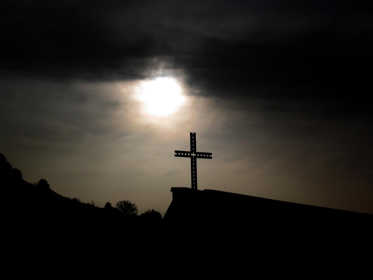 Cross in dark clouds
